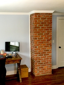 Quite literally, this brick that we exposed on this early 1900s Bloomfield colonial brings warmth to this master suite 