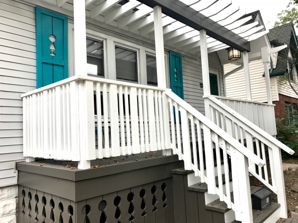 Custom crafted shutters and porch skirting for this front porch renovation - the open arbor was the perfect touch