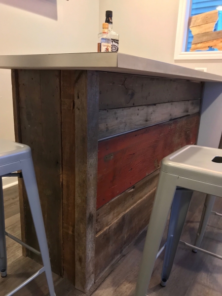 Reclaimed wood created the perfect bar for this very happy customer